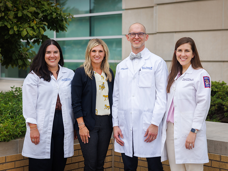 Outdoor group picture with from left to right: Dr. Ashley Villarreal, Jennifer Chappell, Dr. Zeb Henson, and Dr. Meagan Robbins.